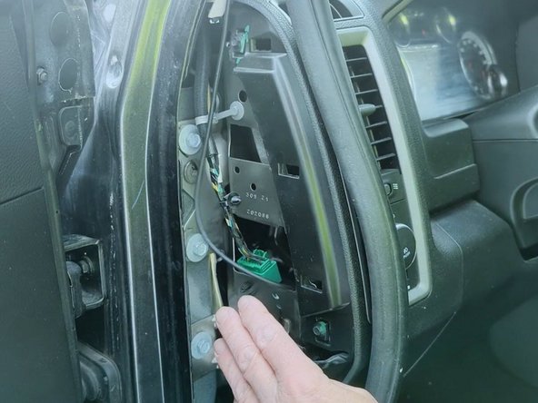 Continue routing the cable through the dash to reach the GO device.