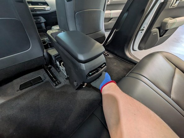 Detach the armrest from its original position.
