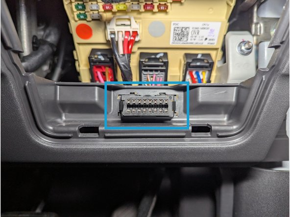 Install the prepared T-harness connector (with adapter 6) and mount it into the factory diagnostic port location.