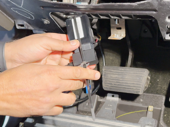 Trim excess cable tie flush.