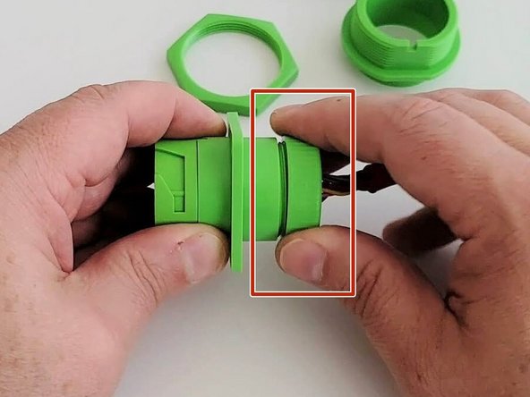 Screw the cap on at the back of the connector housing.