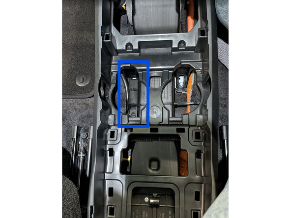 Mount the GO device to a suitable bracket and secure it with cable ties. Leave enough clearance for the cupholders to return to their original position.