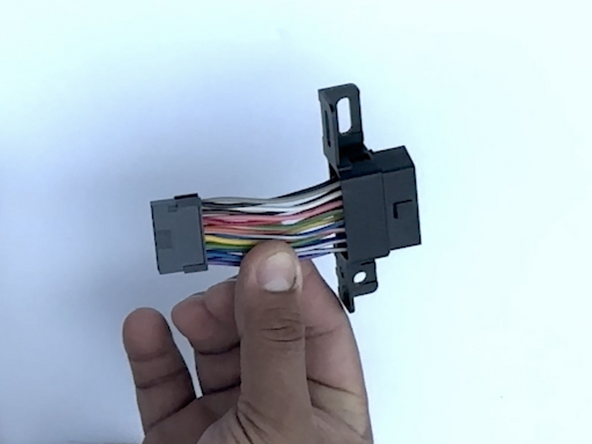 Slide the adapter over the short harness and onto the connector housing.