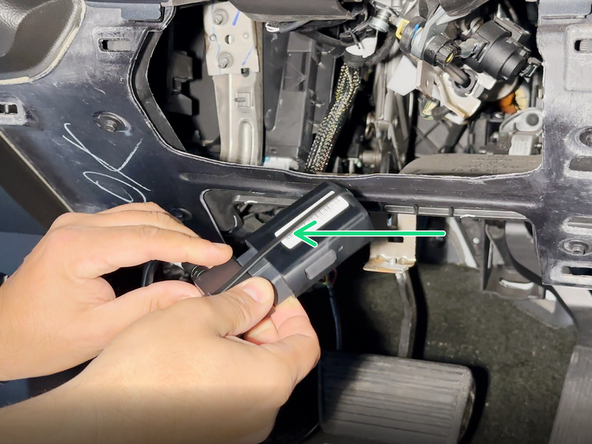 Cut the tie wrap that is securing the GO Device to the harness.