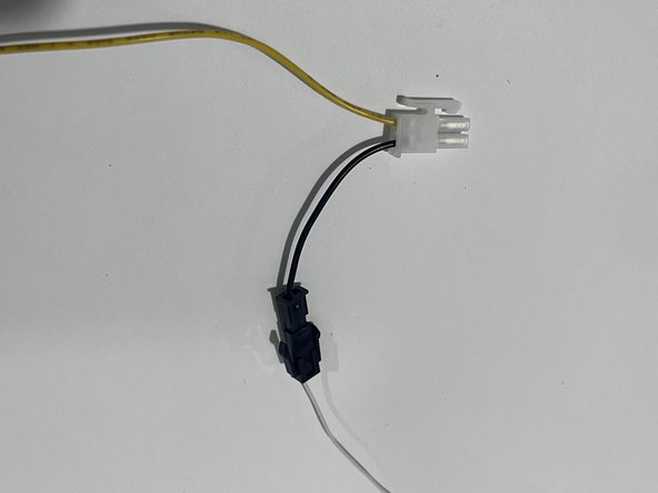 Connect the white wire with the Molex connector to the black wire with the Molex connector on the SPR-IOXREL harness.
