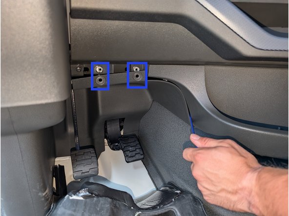 To gain access to the port, two screws (T20 Torx) must be removed as indicated on the right.