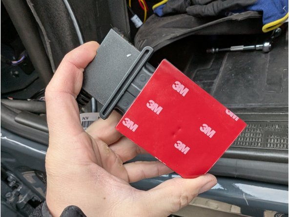 Apply the double sided tape included with the SPR-INSTALLBAG onto the mounting bracket and GO device.