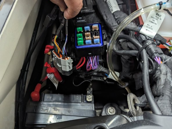 Route the wires towards the chosen power interface point. Make sure you secure the wires using cable ties and clamps as needed to prevent interference with operating the asset.