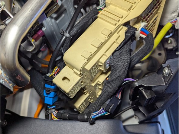 Complete the final installation checks using the reference images. Confirm the harness and device are secure, all panels are correctly refitted, and no loose materials remain.