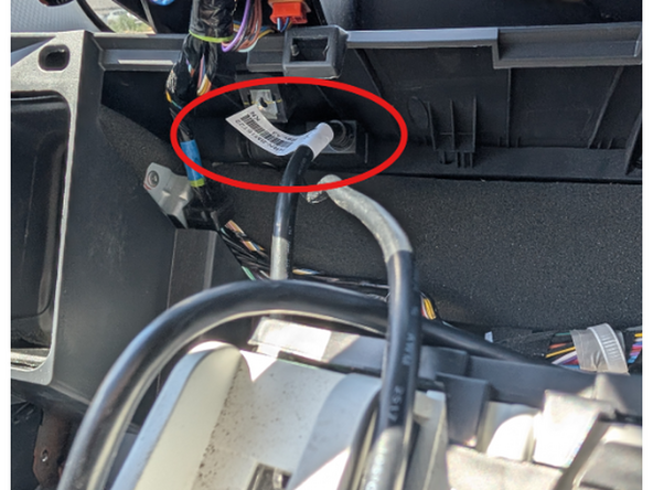 Secure the GO Device to the top left of the cavity behind the cluster.