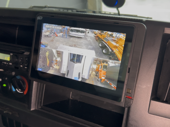 Adjust the monitor angle for optimal visibility from the driver seat, then tighten the ball-mount knob to lock the position.