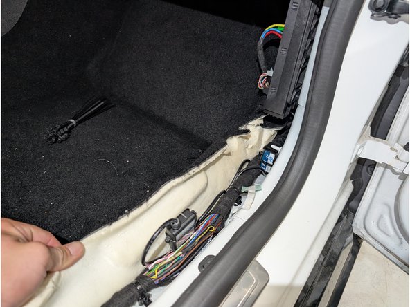 These wires can be found beneath the plastic trim panel removed in the second step of the installation guide.