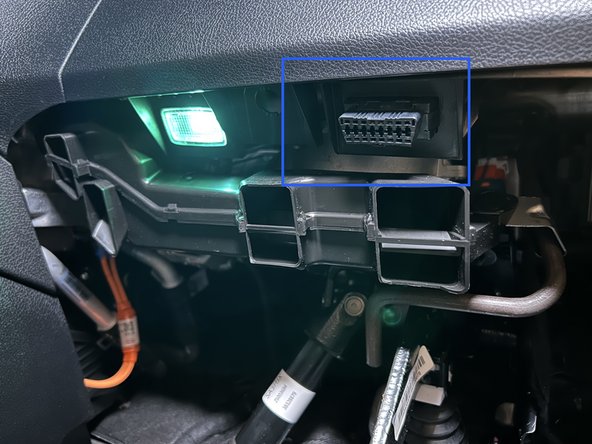 The OBDII connector can be released by pushing in it's clips on either side.