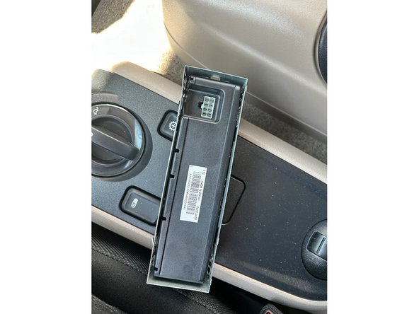Unplug the in-cabin controller from its original vehicle connected harness.