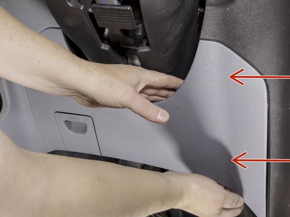 Using a panel removal tool, remove the knee bolster.