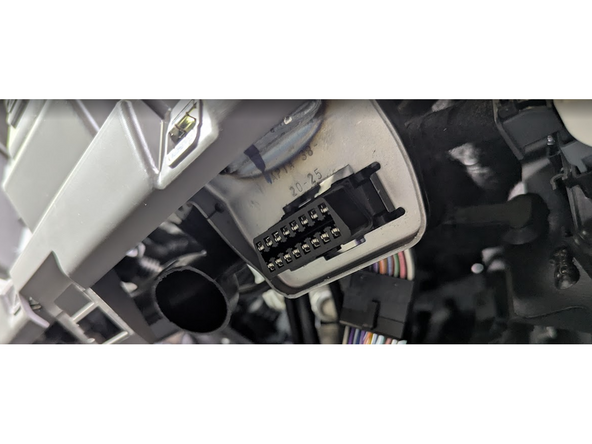 Clip the short section of the harness into place in the vehicle