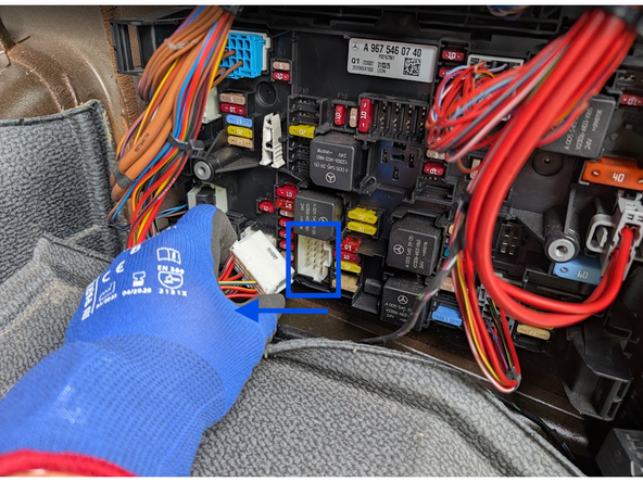 Unclip and remove the white connector (A8X6). Connect the RED (live) and YELLOW (ignition) wires to their respective sources.