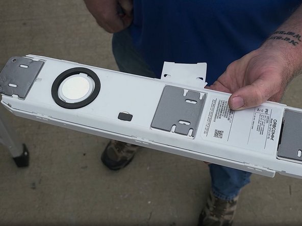 Remove all four VHB tape liners from the device.