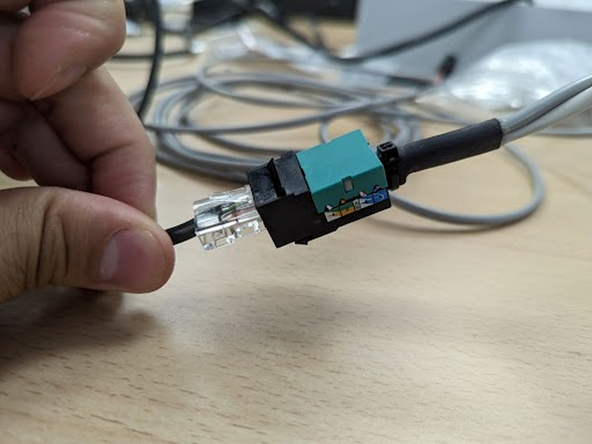 Connect the harness RJ45 female connector to the original vehicle harness that was disconnected.