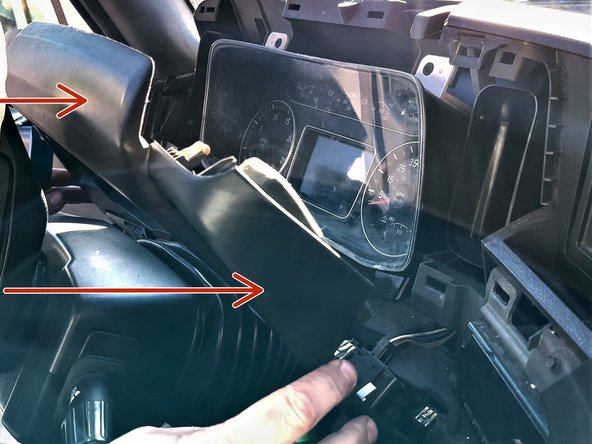 Using a panel removal tool, remove the trim panel around the instrument panel.