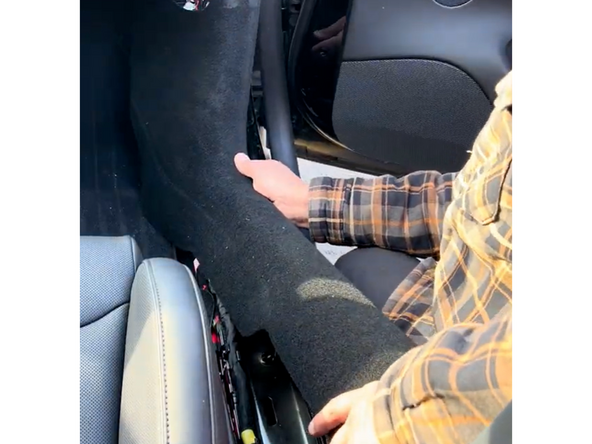 Replace sill/kick panel to the right of the seat clipping back into place.