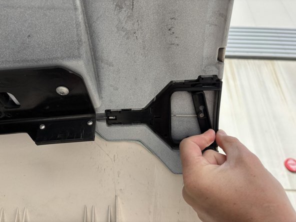 Carefully open both sides of the truck's engine bay by moving the lever as illustrated in the provided photographs.