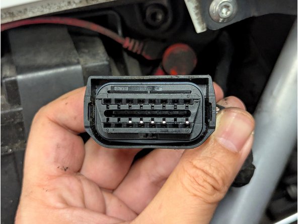 Locate the diagnostic connector and remove the protective cap.