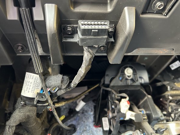 Connect the HRN-BS16S5 extension harness to the HRN-GS16K22 harness and route it towards the passenger side of the vehicle.