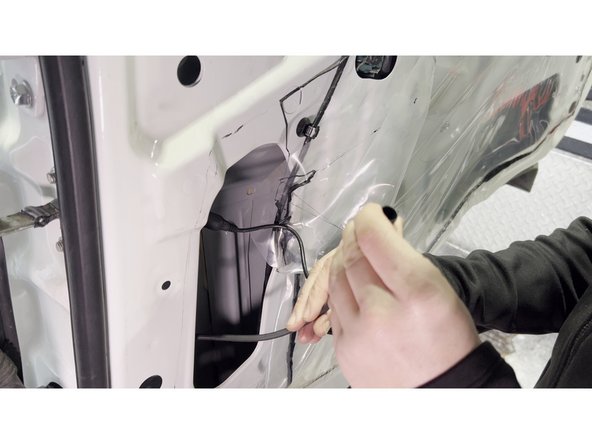 Peel back the factory plastic vapor barrier (poly sheeting) carefully — avoid tearing it, as it will be re-sealed when the panel goes back on.