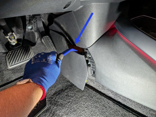 Use panel removal tool to remove the center console cover from both driver and passenger sides.
