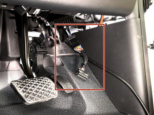 Plug the female connector from the T-harness into the OEM OBDII connector.