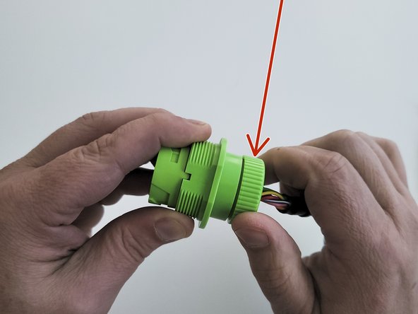 Once the cartridge is inserted into the connector housing, it should appear flush with the housing.