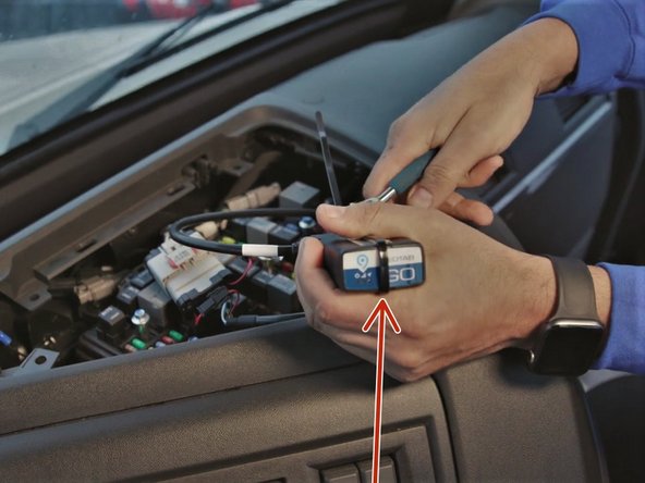 Secure the device to the harness with included cable tie.