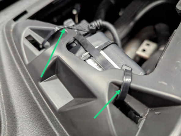 Mount the GO in the existing slots that hold the top dash panel in place using 2 cable ties as shown.