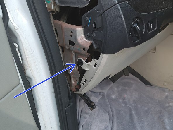 Remove this plastic rivet fastener.