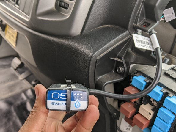 Connect the GO device and secure it with the provided zip tie. Neatly run the GO device and cabling to the top dash to the left of the fuse box.