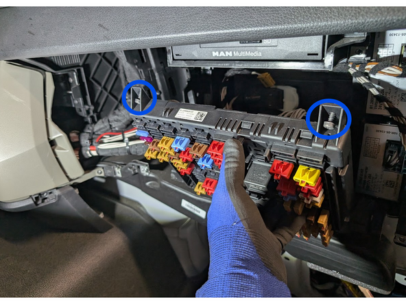 Remove the two screws located at the top of the fuse panel and carefully move it aside.
