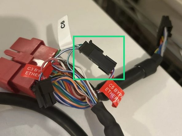 Disconnect the 4-pin Molex connectors labeled C3 &amp; C5 Bypass Ethernet.