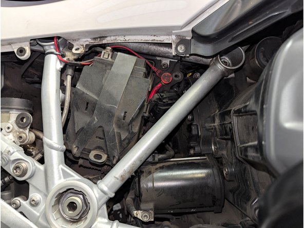 For better access when routing the harness, also remove the spring-strut cover from grommets.