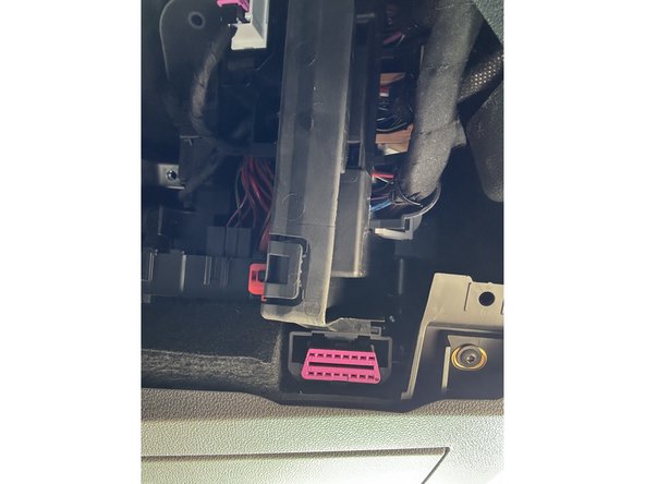Locate the OBD-Port below the steering wheel in the driver’s footwell.
