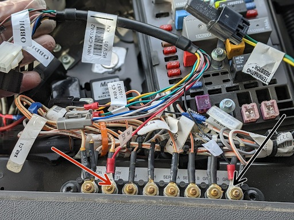 Connect the red wire on the HRN-CK10A2 harness (labeled BATT) to the second pin on the bus bar (labeled Battery).