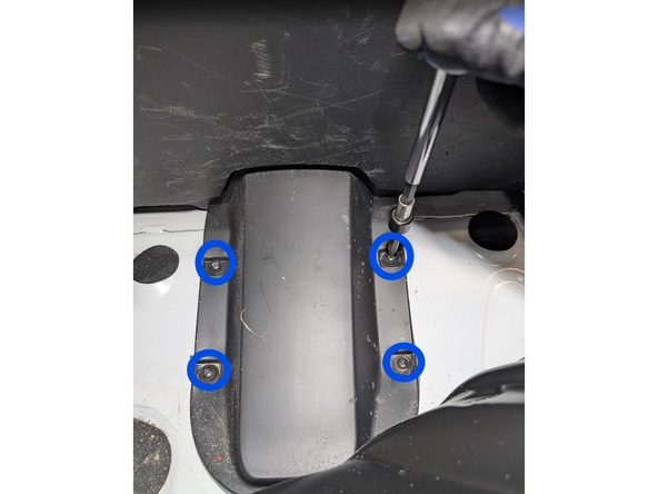 Unscrew the 4 screws as shown.
