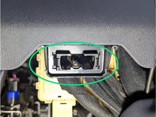 Clip ADAPTER-6 (from behind) in the metal bracket of the Vehicle.