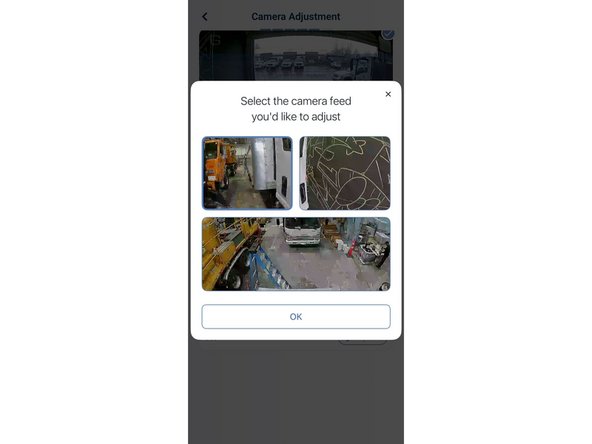 In the Geotab Video app, tap Camera Adjustment. When the dialog appears, tap one of the auxiliary side camera feeds to open its Auxiliary Camera Adjustment screen.
