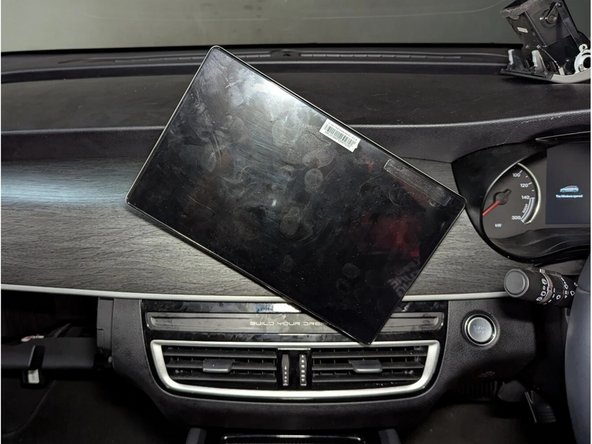 Unplug the blue connector to completely remove the infotainment display.