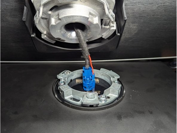 Unplug the blue connector to completely remove the infotainment display.