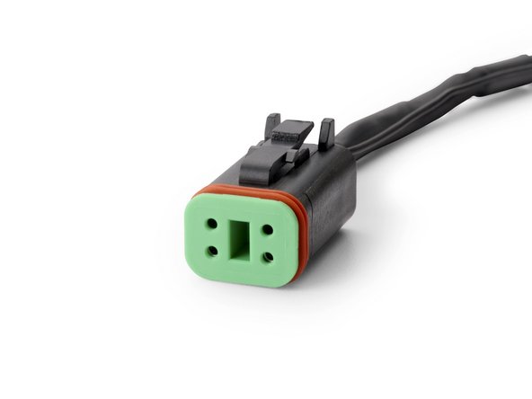 Connect the HRN-RCCTKTG6 harness to the Serial Port 4-pin Deutsch connector located near the behind the controller.