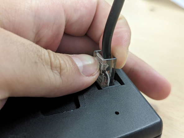 Unplug the male RJ45 connector from the controller that belongs to the original vehicle connected harness.