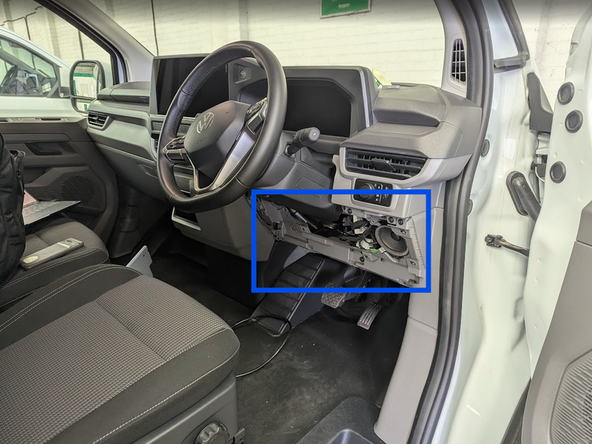 Unclip and remove the panel from the side of the dashboard.