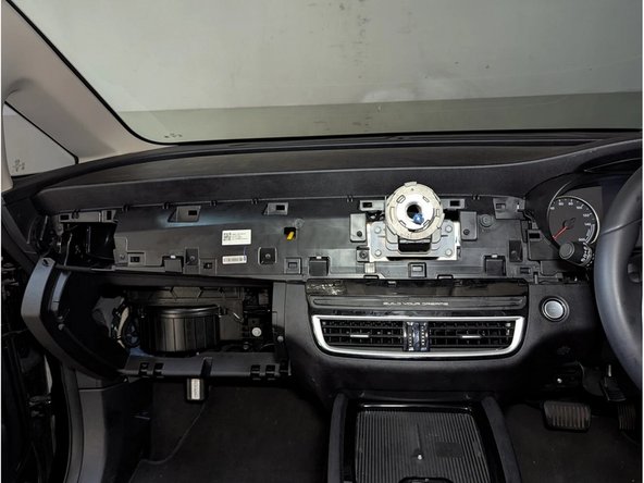 Remove the side air vent using a flat-bladed screwdriver or plastic pry tool.